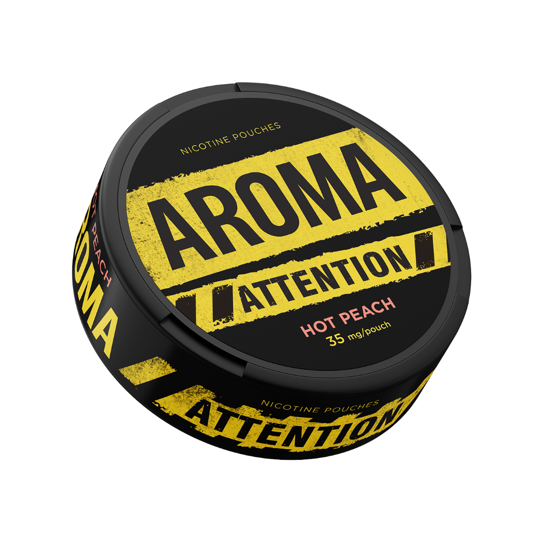Detail close-up of the black can featuring bold text and a circular label design with peach color accents.