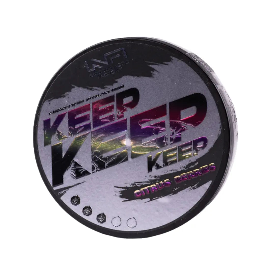 Detail close-up of a glossy black and purple circular container featuring vibrant yellow and pink design elements