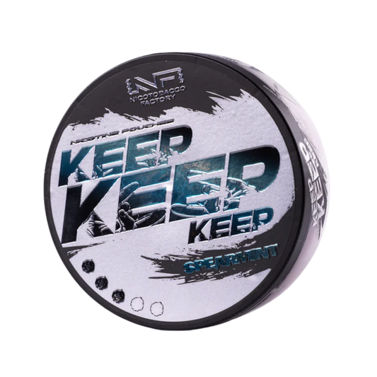 Detail close-up of the round container featuring smooth black, white, and blue colors with graphic text.
