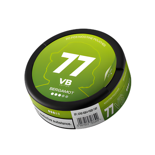 Detail close-up of the green circular can featuring large number 77, brand logo, and nutritional information on a white ba…